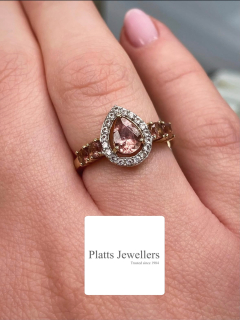Pretty in pink 💍This elegant pear cut pink topaz ring, surrounded by sparkling cubic zirconias and set in 9ct yellow gold, is available now at Platts Jewellers inside Middleton Shopping Centre.A timeless piece with just the right amount of sparkle ✨#MiddletonShopping #JewelleryStyle #PinkTopaz #GoldJewellery #GiftInspo ShopLocal MiddletonManchester